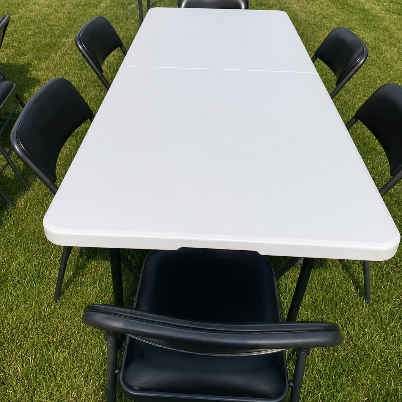 6ft folding banquet table with folding chairs, outdoors